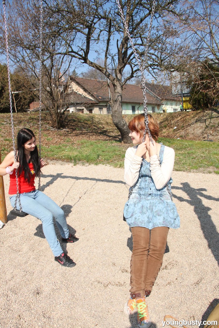 Young girls discover their love of lesbian sex at a schoolyard playset picture 1 of 15