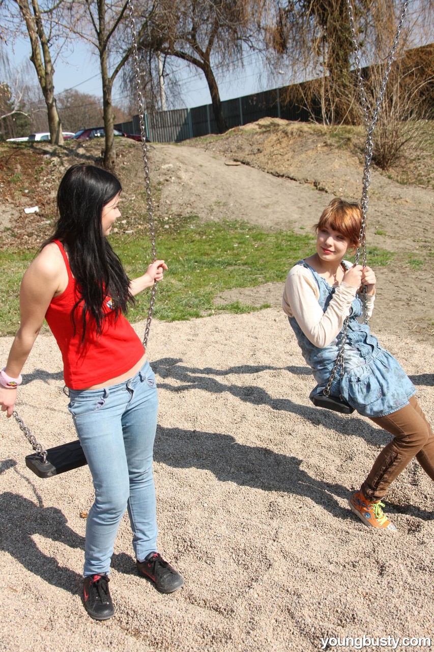 Young girls discover their love of lesbian sex at a schoolyard playset picture 2 of 15