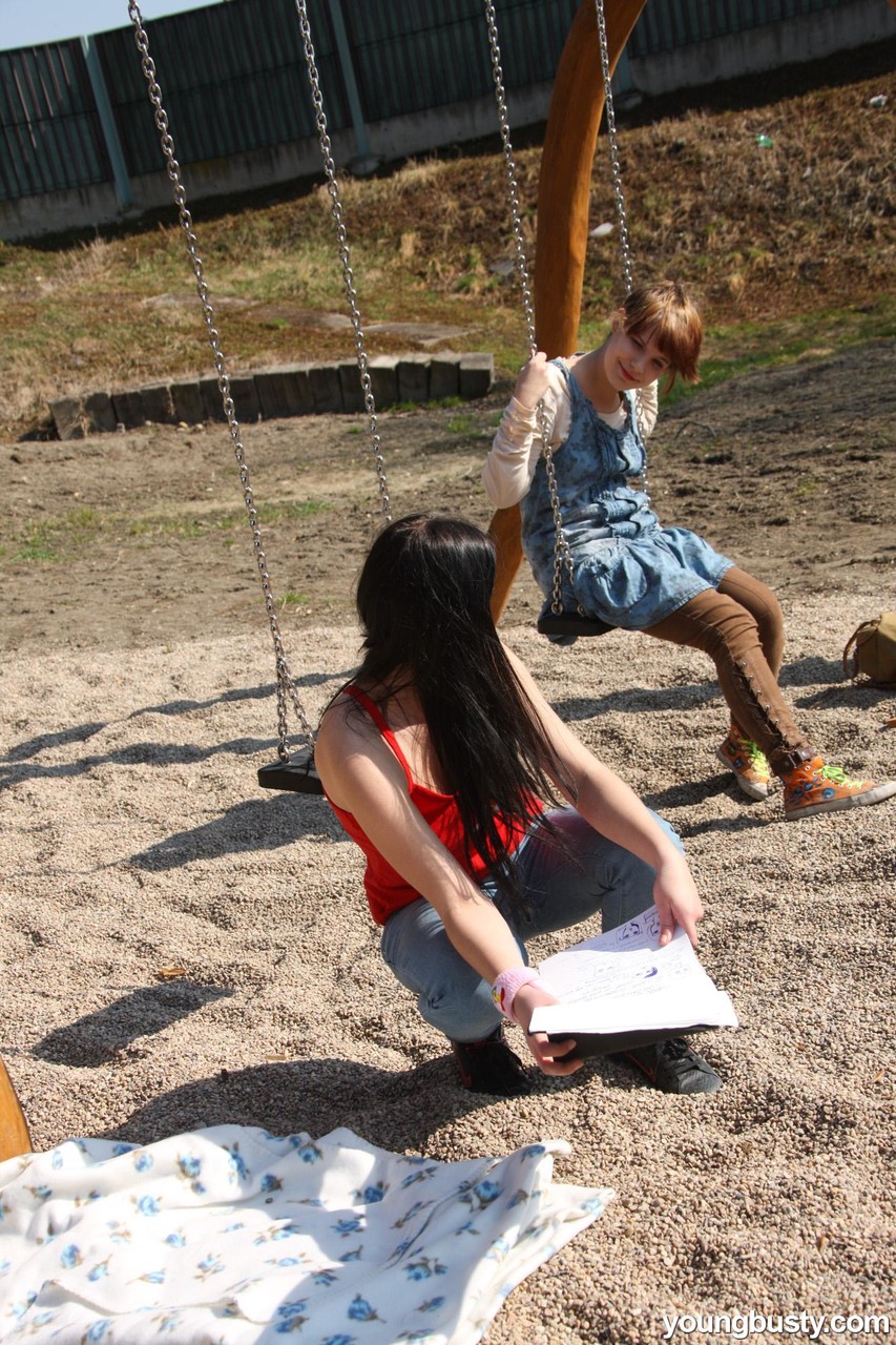 Young girls discover their love of lesbian sex at a schoolyard playset picture 3 of 15