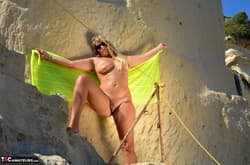 Blonde amateur Sweet Susi displays her plump body while wearing sunglasses'