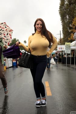 Curvaceous babe Angela White strips her bra and teases with her nips in public'